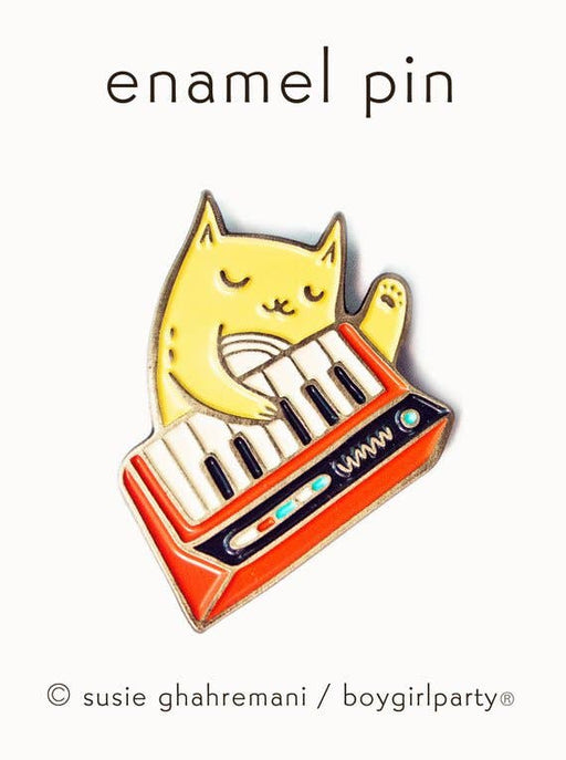 Enamel pin of a cat playing a keyboard