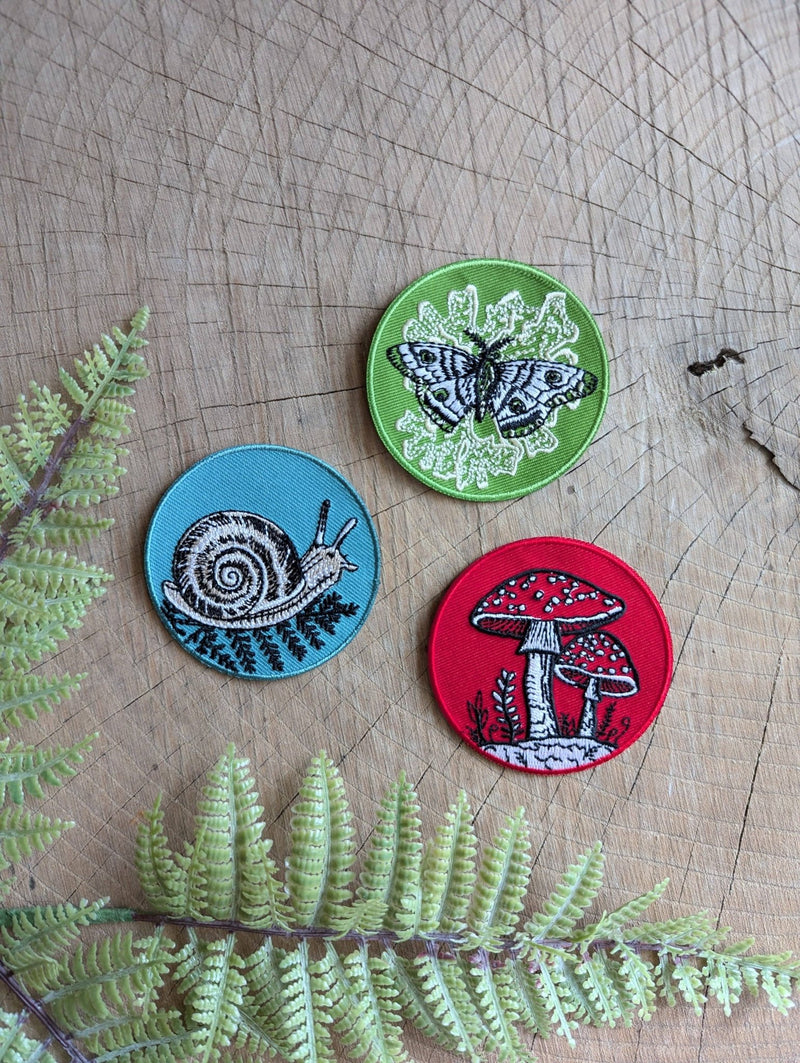 Iron-on patch | fly agaric mushroom - 2.5" round red - Art Department LLC