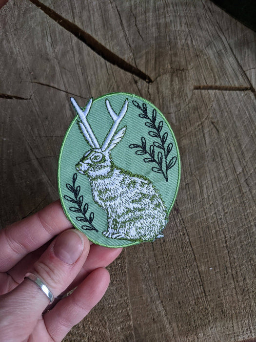 Iron-on patch | jackalope - green oval 2.5" x 3.2" - Art Department LLC