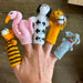 Hand with knitted finger puppets of various animals on a neutral background