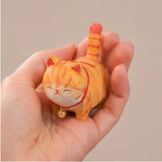 Hand-Carved Wooden Orange Cat Figurine with Bell - Art Department LLC